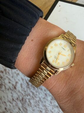 Timex Gold Tone Watch with White Dial and Gold Numerals